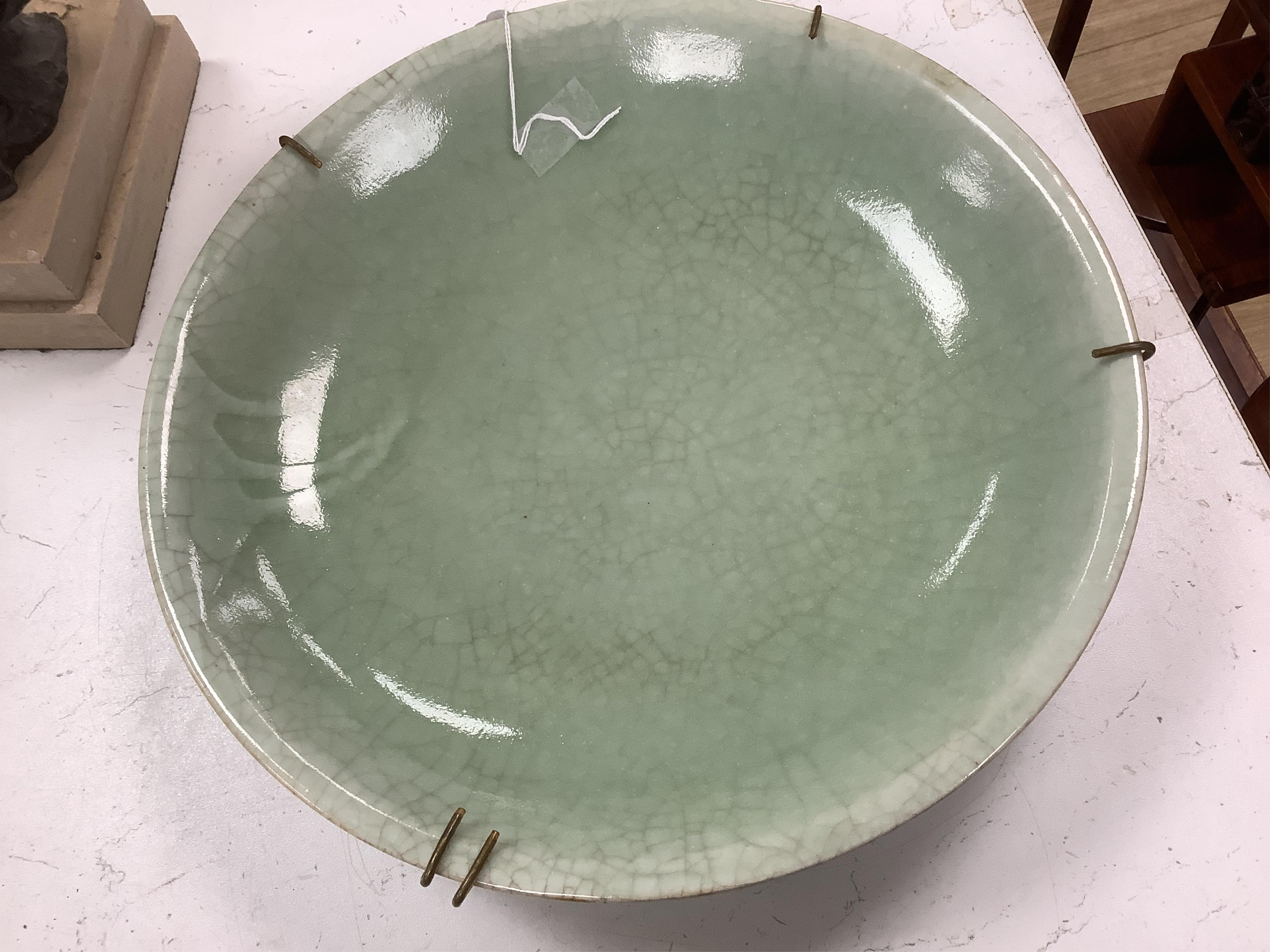 A Chinese celadon glazed dish, late Qing, 34cm in diameter